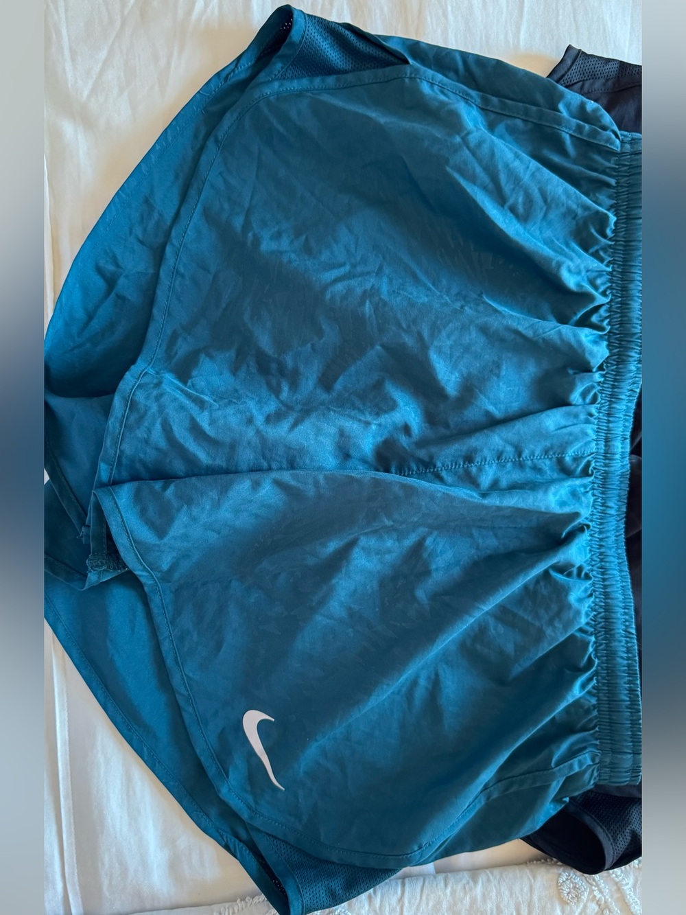 Nike Teal Athletic Shorts with White Swoosh